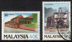 1986 stamp showing the old Dutch Townhall and the Portuguese Santiago Fort.